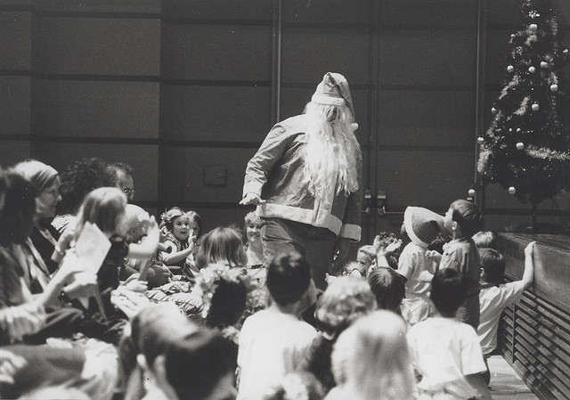Santa Claus surrounded by children at the University of Newcastle, Australia